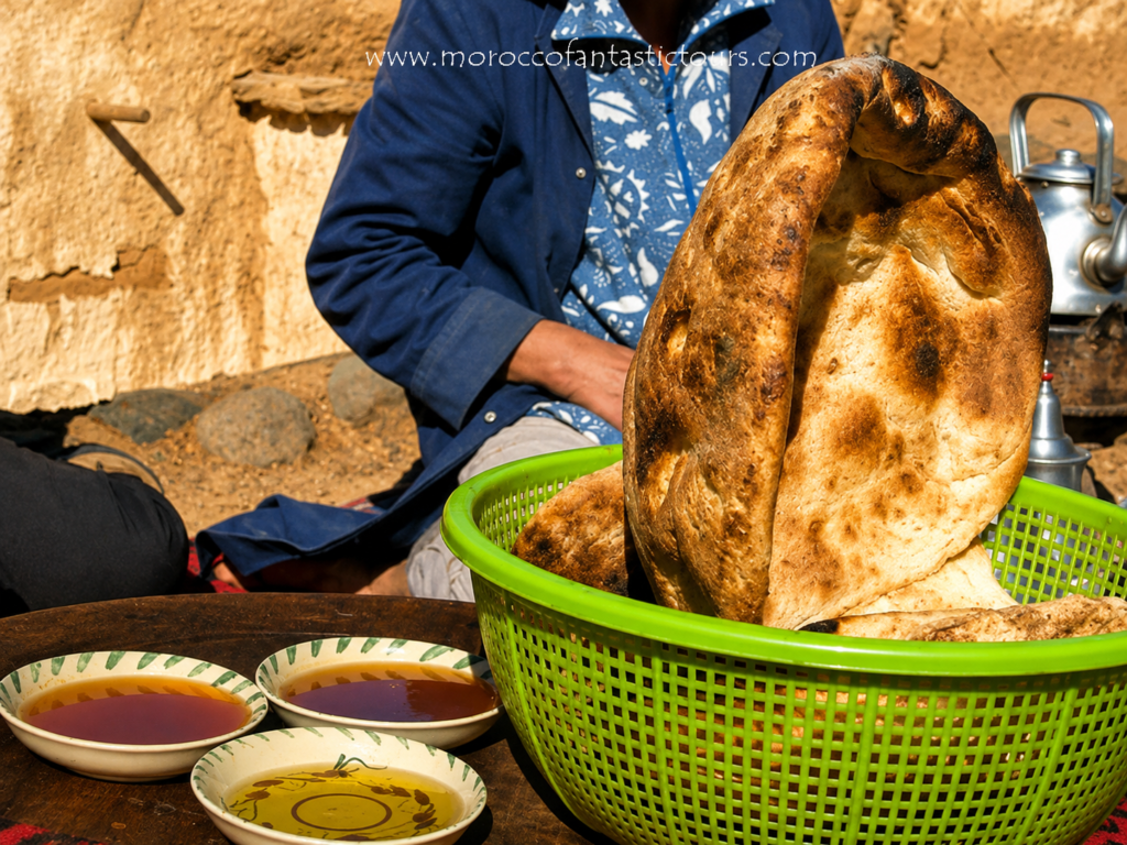 Pan bereber tradicional con té marroquí y aceite de oliva durante un trekking por Amizmiz